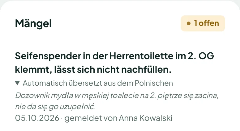 Mängelmeldung im Büro auf Deutsch, darunter das polnische Original